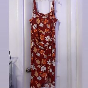 Woman’s stretch floral dip hem dress (short front and long back) in size XL.